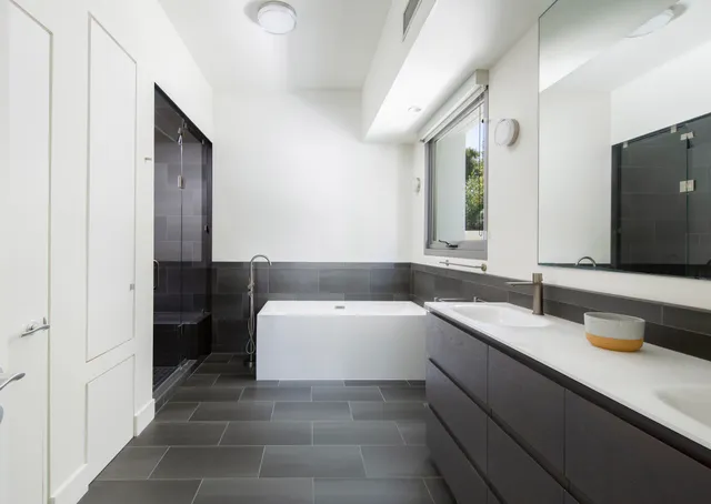 a bedroom with bed and window