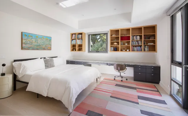 a bedroom with a bed and a couch