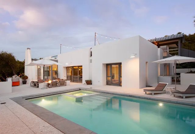 a view of swimming pool with outdoor seating