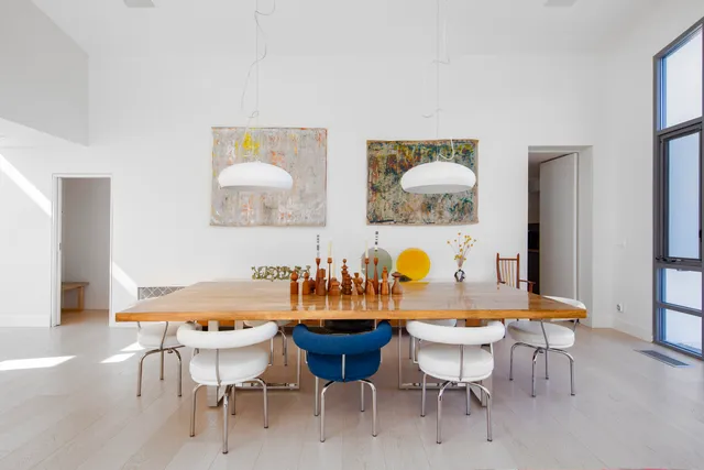 a dining room with furniture and window