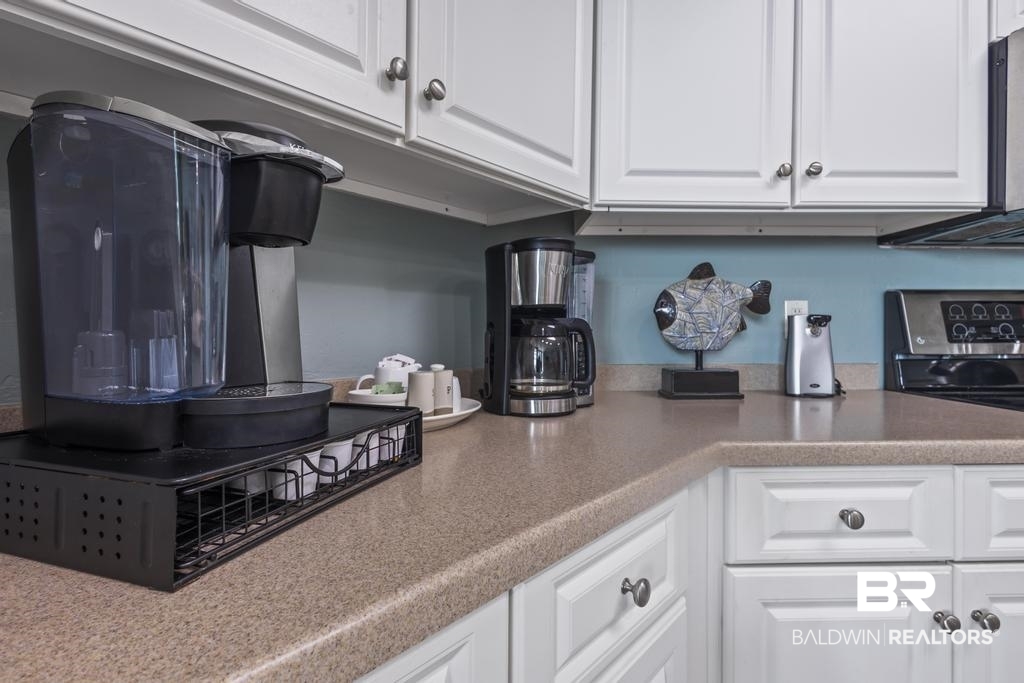27582 Canal Road, Unit 2408 Orange Beach, AL 36561 - Photo 4 of 47 Kitchen featuring white cabinets