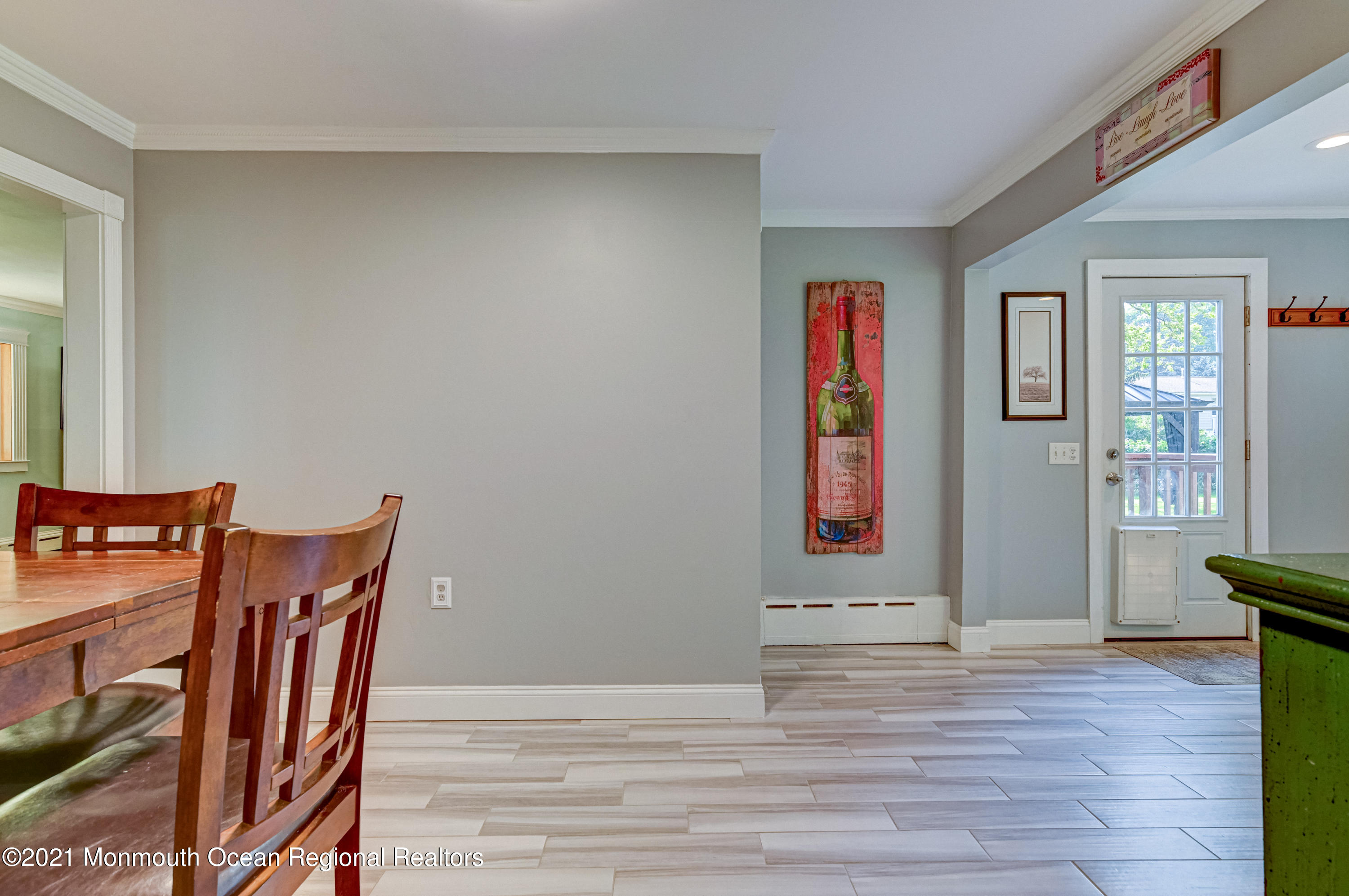 116 Bethany Road Hazlet, NJ 07730 - Photo 11 of 30 a view of an empty room with wooden floor and windows