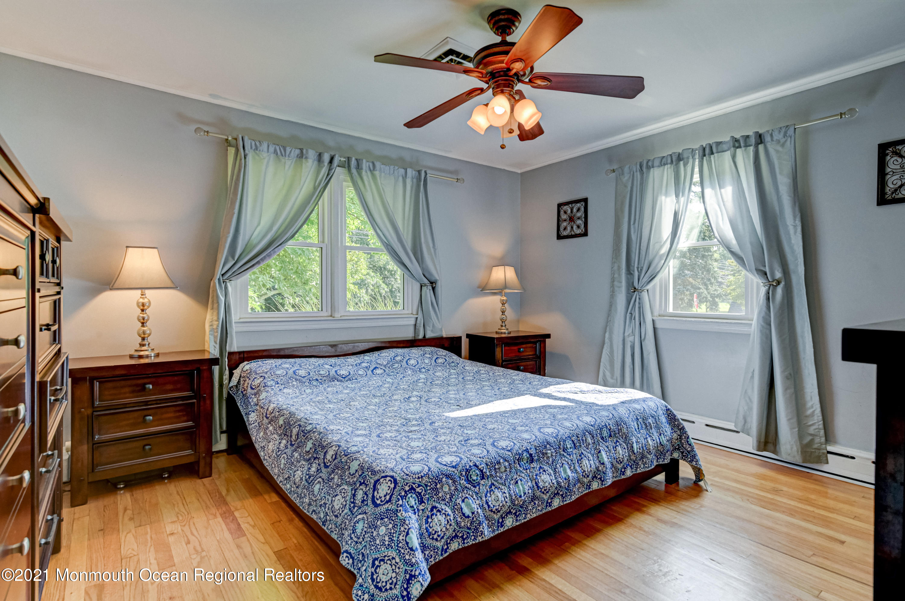 116 Bethany Road Hazlet, NJ 07730 - Photo 14 of 30 a bedroom with a large bed and a window