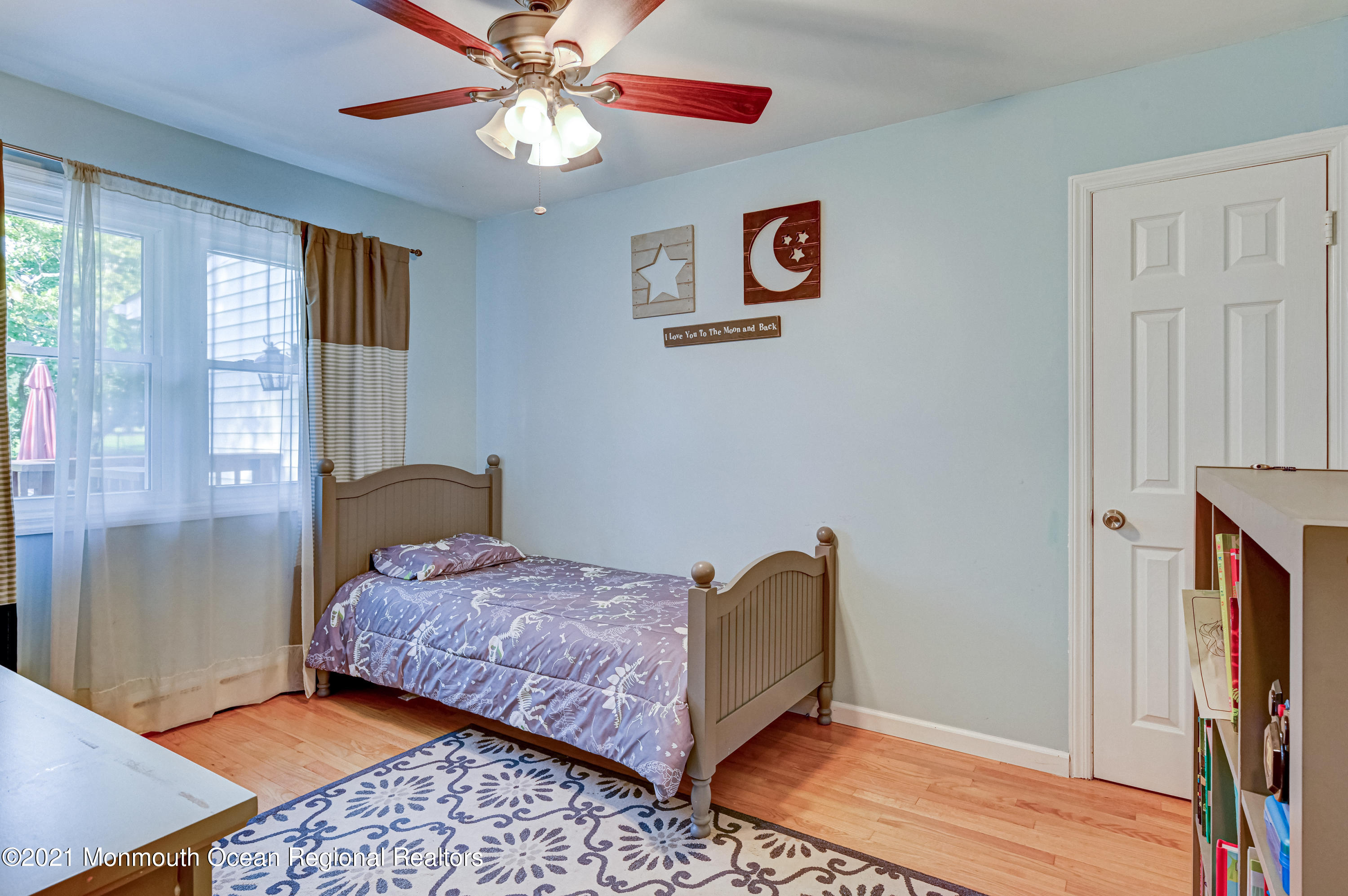 116 Bethany Road Hazlet, NJ 07730 - Photo 16 of 30 a bedroom with a bed and wooden floor