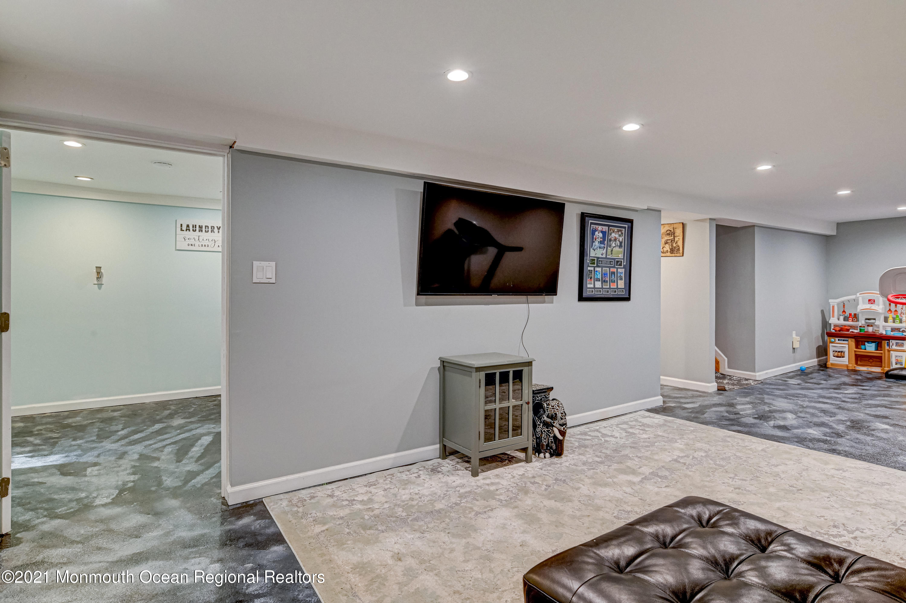 116 Bethany Road Hazlet, NJ 07730 - Photo 21 of 30 a living room with furniture and a flat screen tv