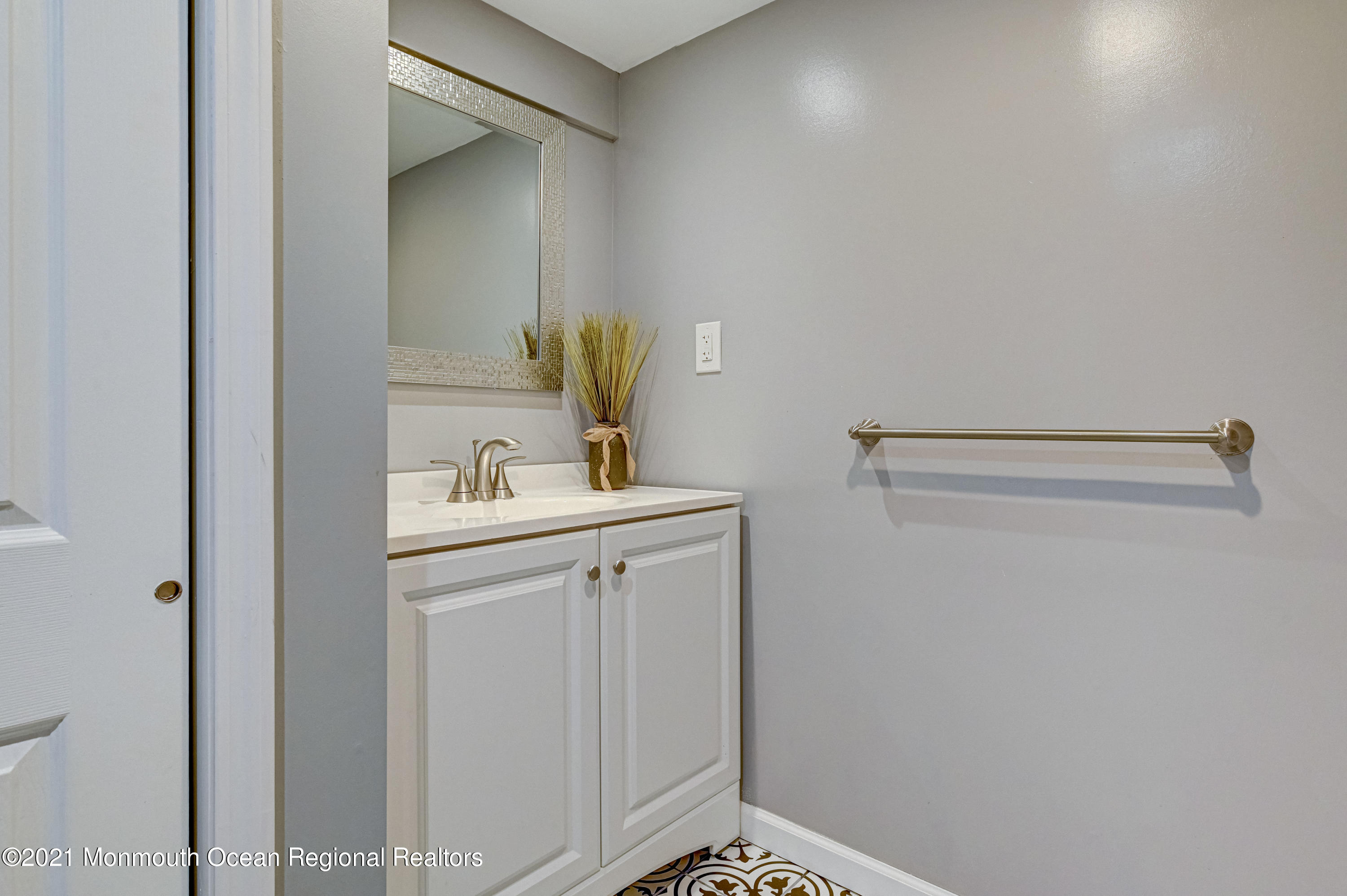 116 Bethany Road Hazlet, NJ 07730 - Photo 23 of 30 a bathroom with a sink and mirror