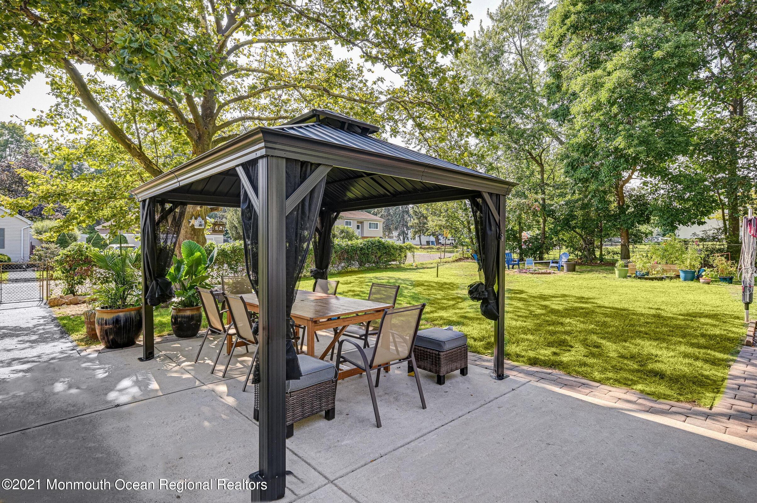 116 Bethany Road Hazlet, NJ 07730 - Photo 27 of 30 a view of a porch with furniture and garden