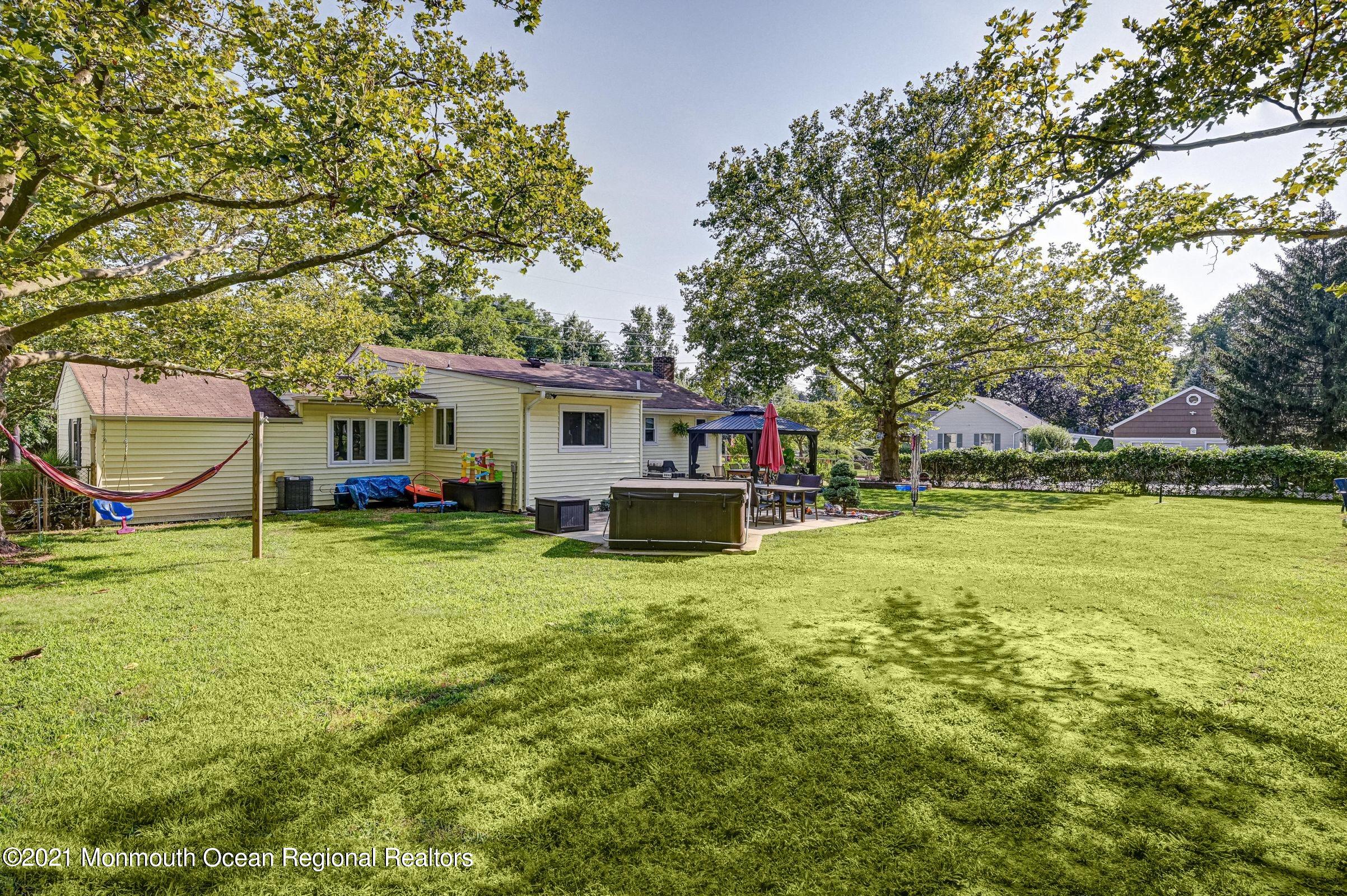 116 Bethany Road Hazlet, NJ 07730 - Photo 29 of 30 a view of a house with a yard and sitting area