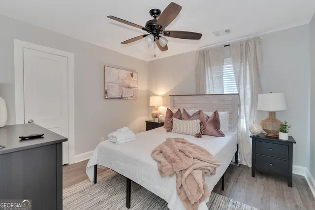 a bedroom with a bed and a desk