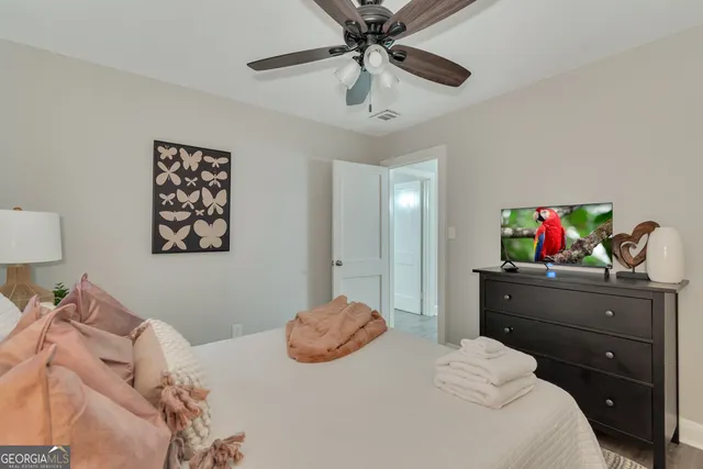 a bedroom with a bed and a dresser