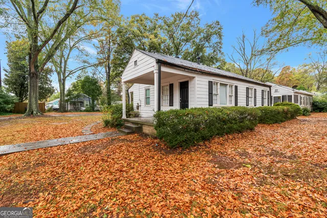a house with trees in the background