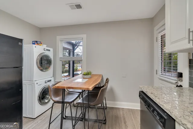 a view of a kitchen area with furniture and washer