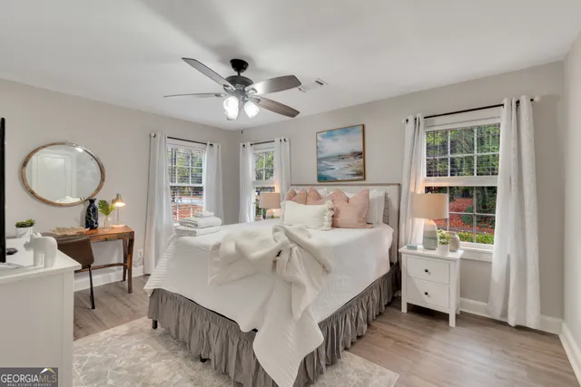 a bed room with a bed and a chandelier