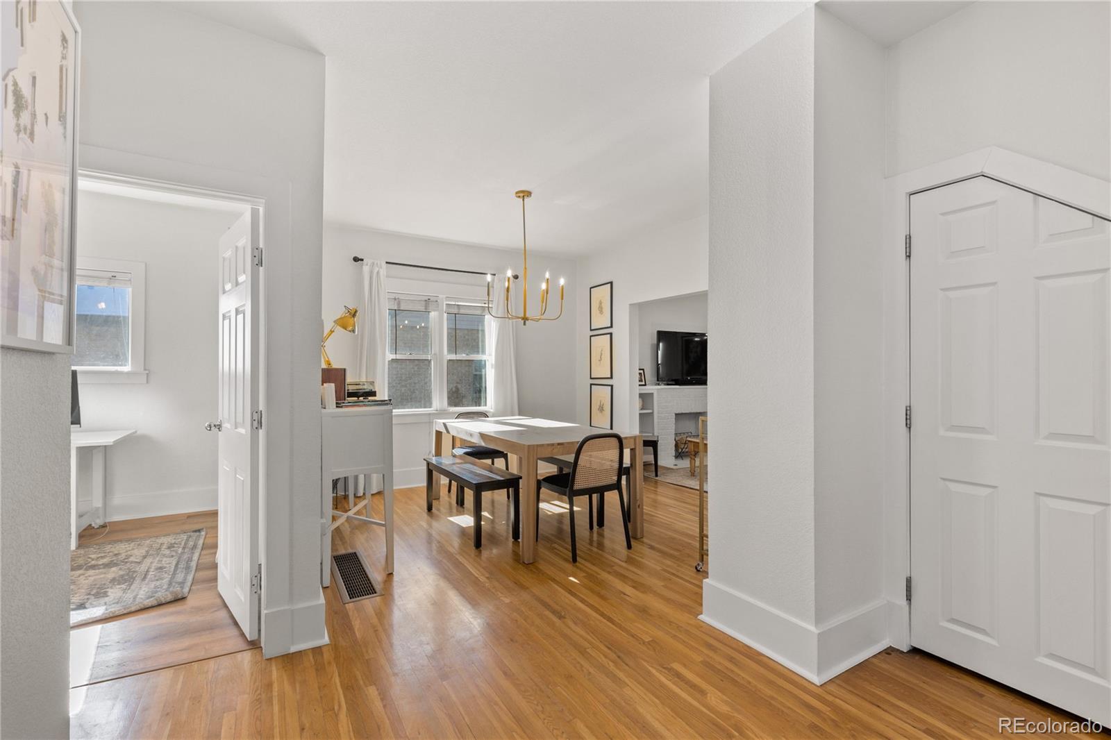 2740 Fillmore Street Denver, CO 80205 - Photo 14 of 45 a view of a dining room with furniture and wooden floor