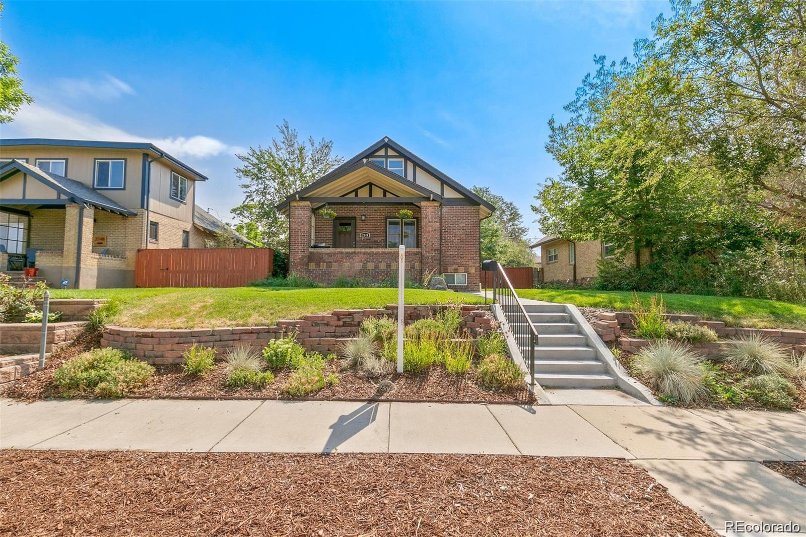 2740 Fillmore Street Denver, CO 80205 - Photo 2 of 45 a view of a house with a yard