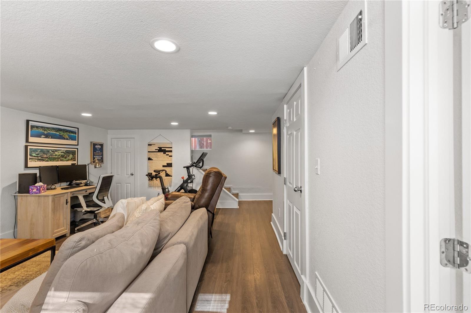 2740 Fillmore Street Denver, CO 80205 - Photo 35 of 45 a view of a livingroom with furniture and a flat screen tv