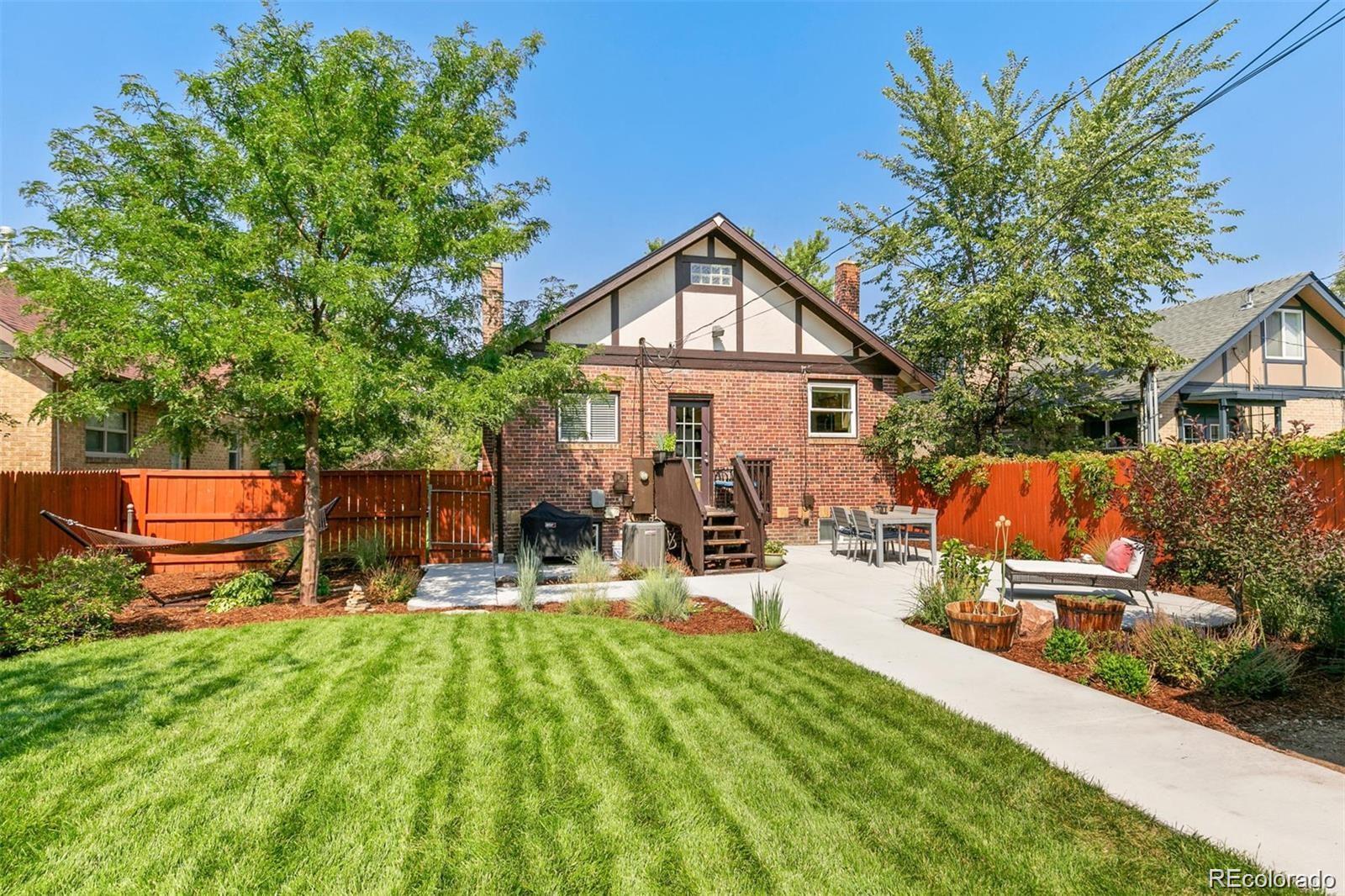 2740 Fillmore Street Denver, CO 80205 - Photo 39 of 45 a view of a backyard with sitting area and slide