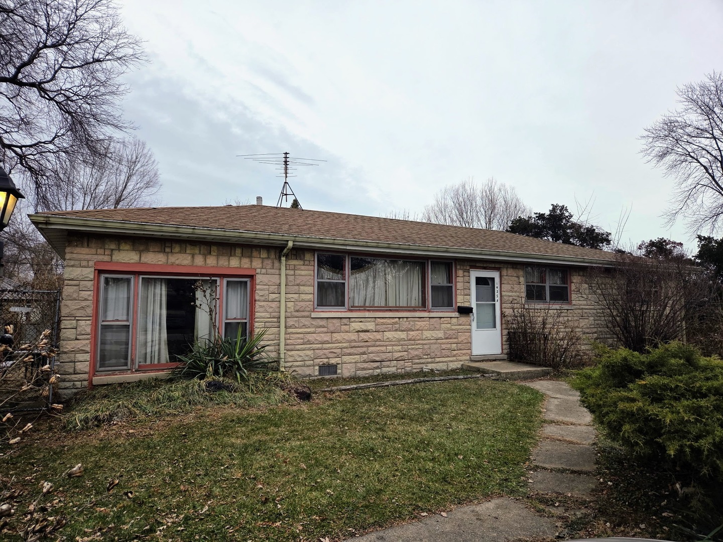 14340 Kostner Avenue Midlothian, IL 60445 - Photo 2 of 15 a front view of a house with a yard