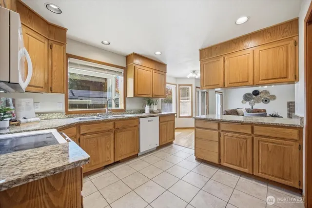 a kitchen with a sink stove and cabinets