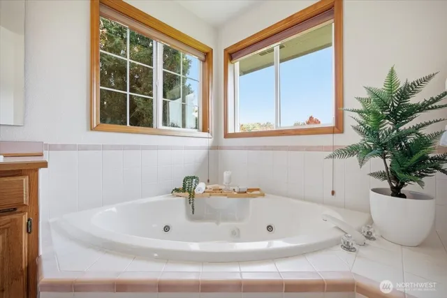 a bath tub sitting next to a window