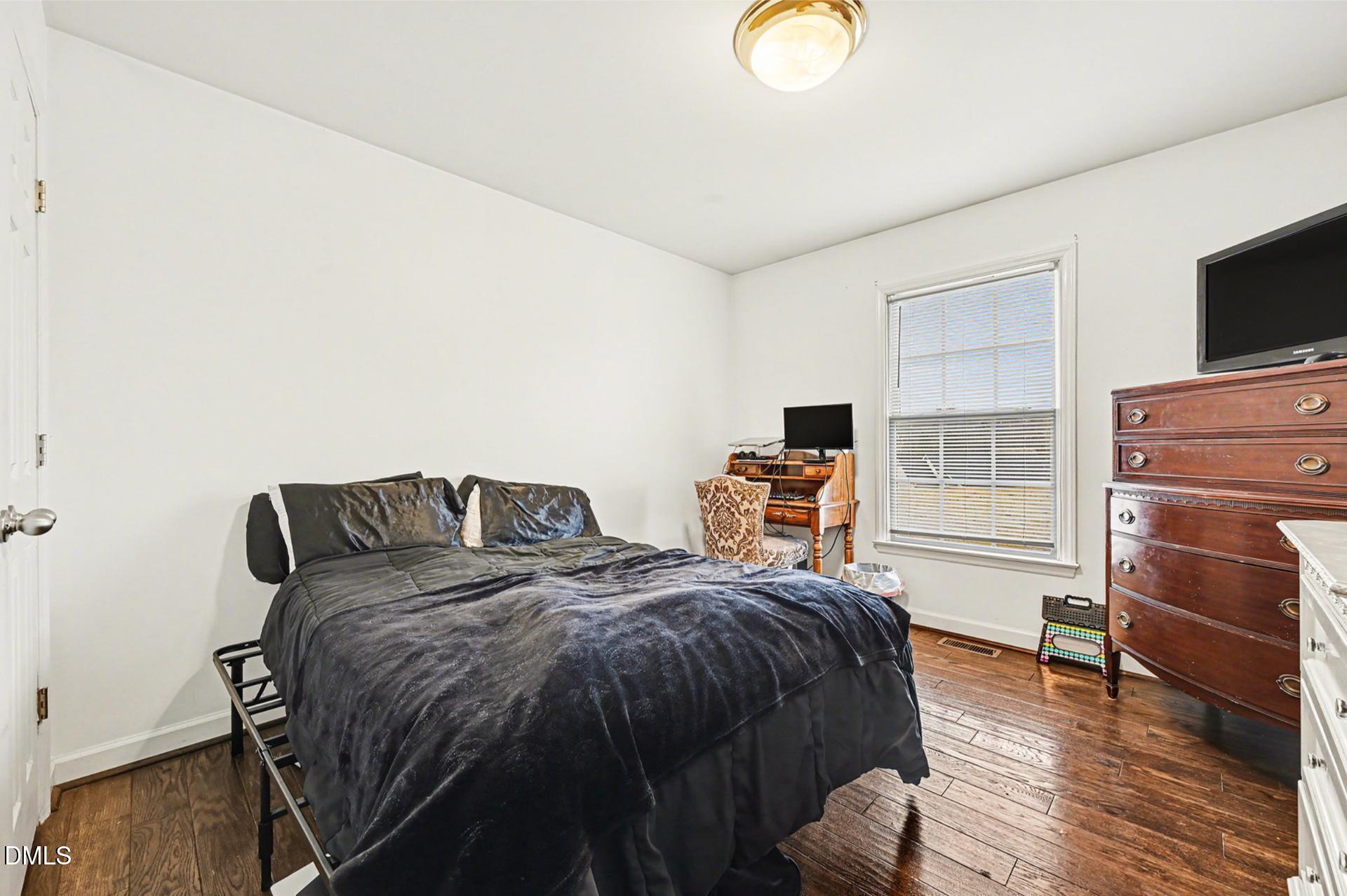 2070 Haw River Hopedale Road Burlington, NC 27217 - Photo 14 of 30 a bedroom with two beds and a flat screen tv