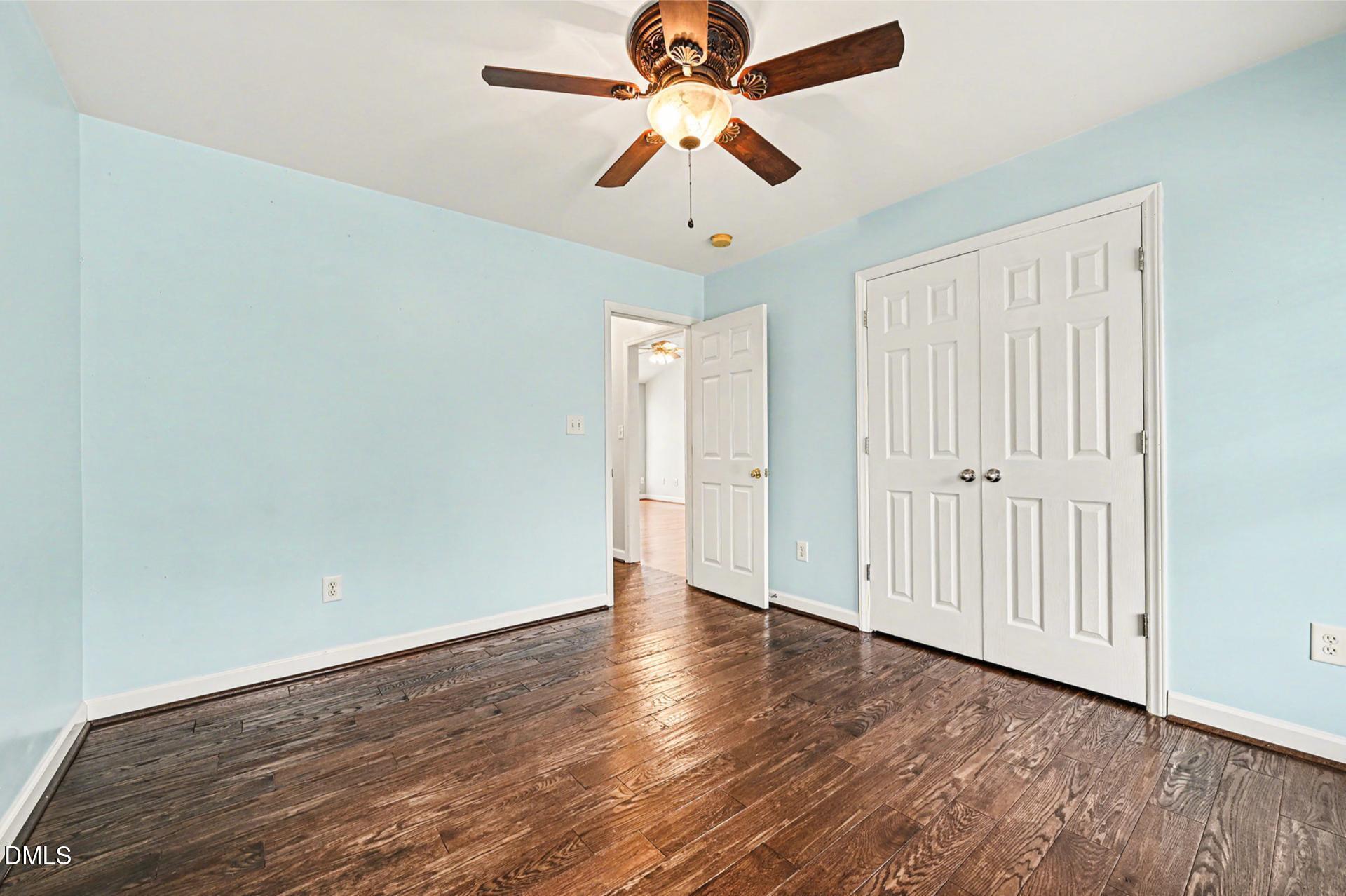 2070 Haw River Hopedale Road Burlington, NC 27217 - Photo 19 of 30 wooden floor in an empty room with a window