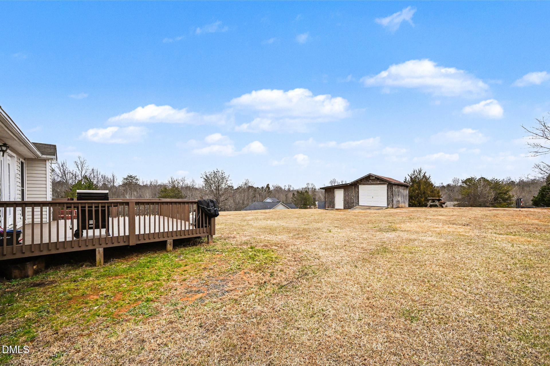 2070 Haw River Hopedale Road Burlington, NC 27217 - Photo 25 of 30 a view of a house with a yard