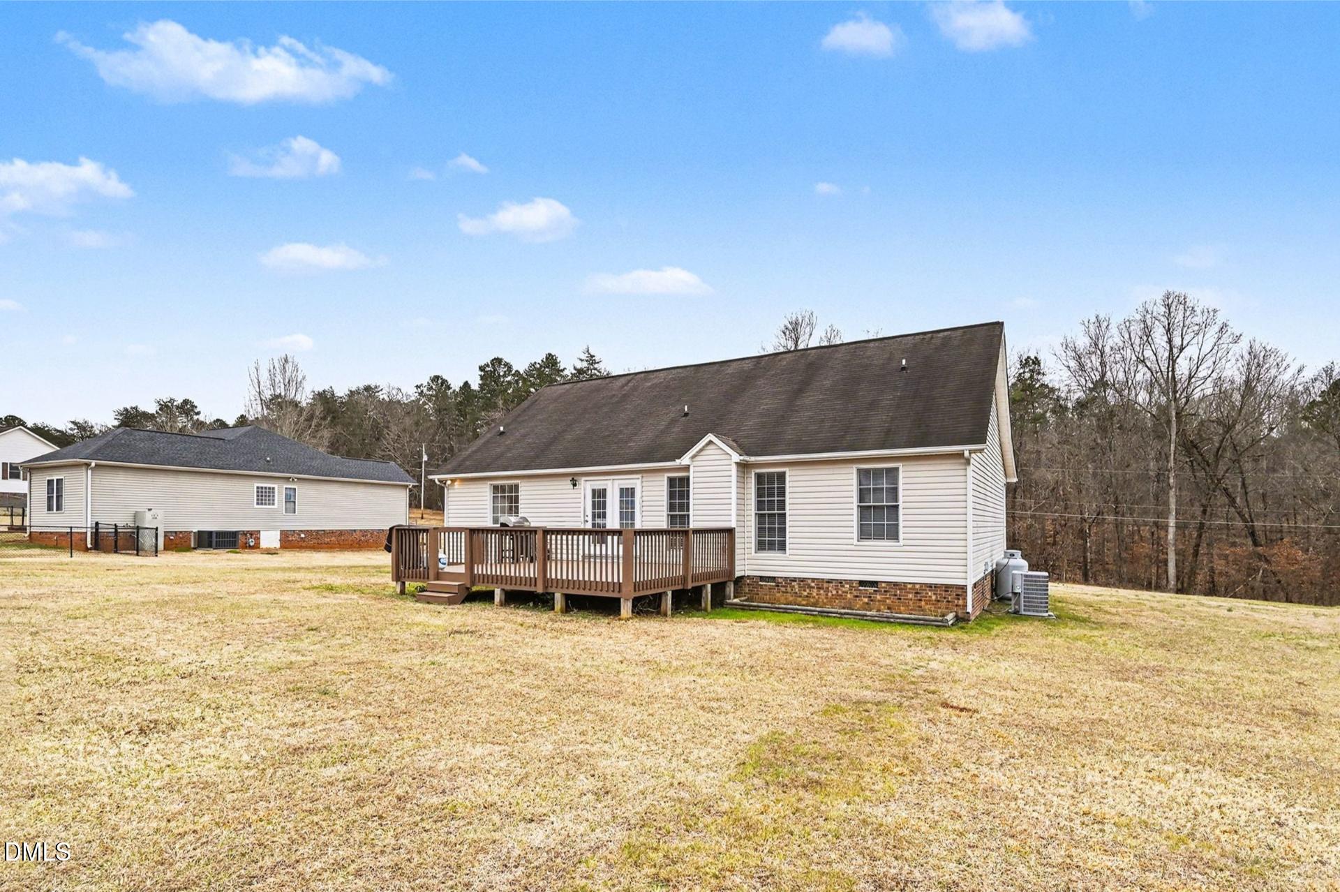 2070 Haw River Hopedale Road Burlington, NC 27217 - Photo 28 of 30 a view of a house with a yard and sitting area