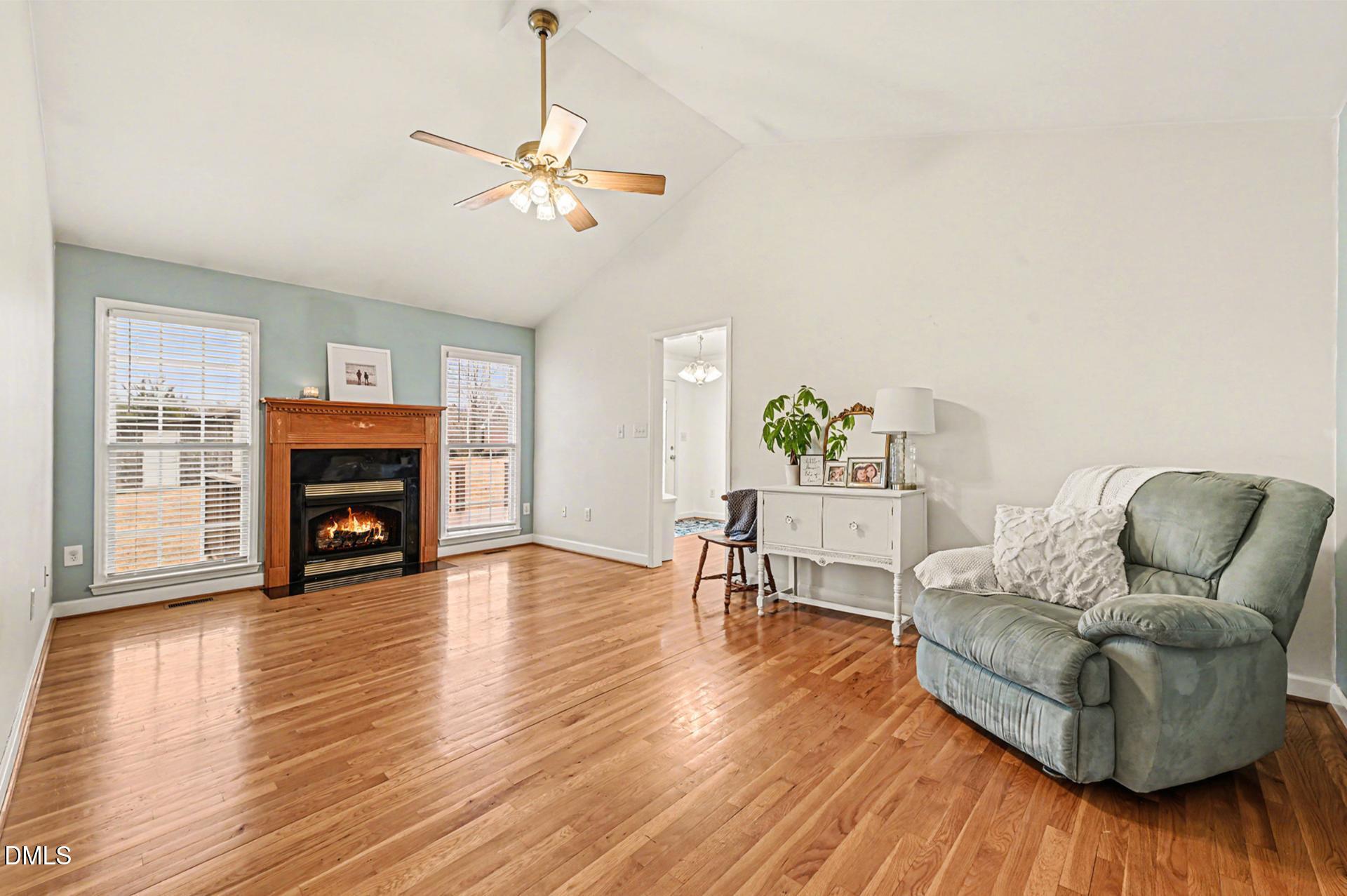 2070 Haw River Hopedale Road Burlington, NC 27217 - Photo 6 of 30 a living room with furniture and a fireplace
