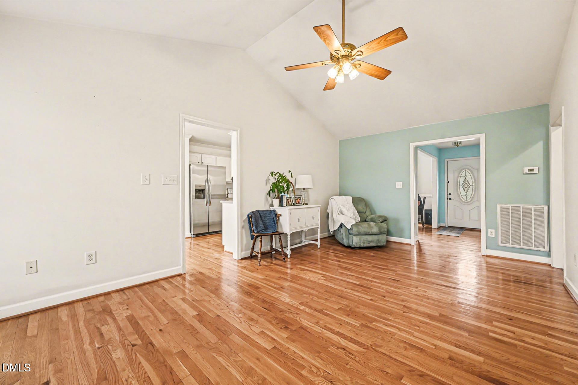 2070 Haw River Hopedale Road Burlington, NC 27217 - Photo 7 of 30 a living room with furniture and a table with wooden floor
