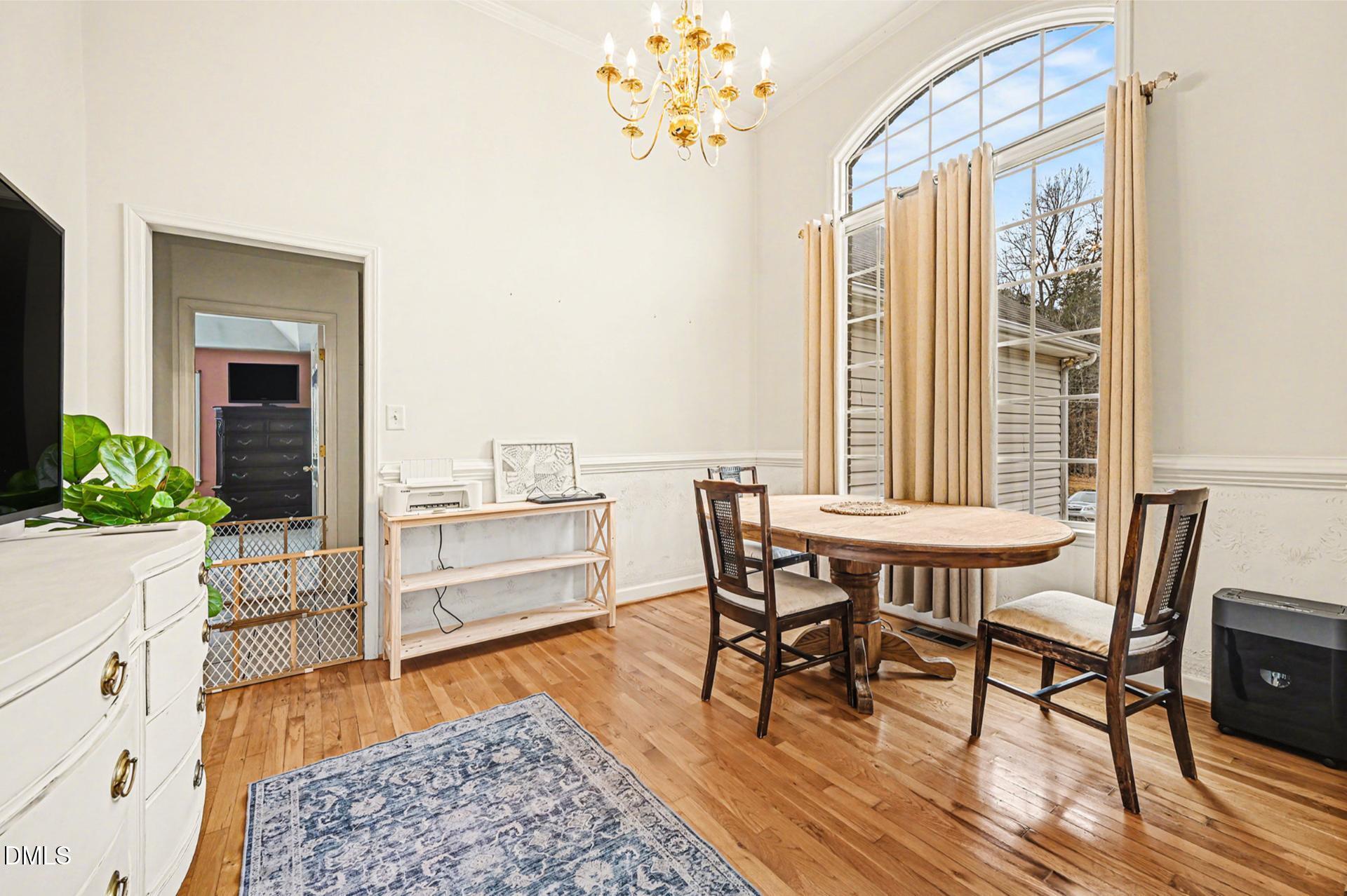 2070 Haw River Hopedale Road Burlington, NC 27217 - Photo 8 of 30 a dining room with furniture and wooden floor