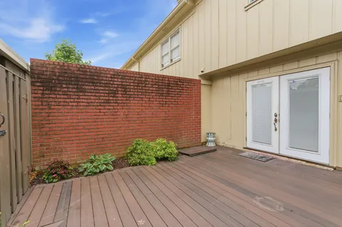 a view of backyard with potted plants