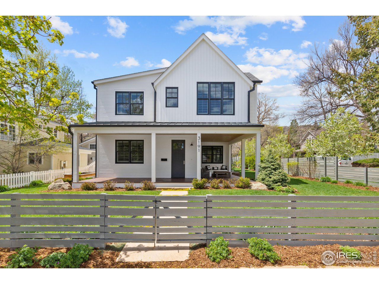 3191 9th Street Boulder, CO 80304 - Photo 1 of 40 a front view of a house with garden