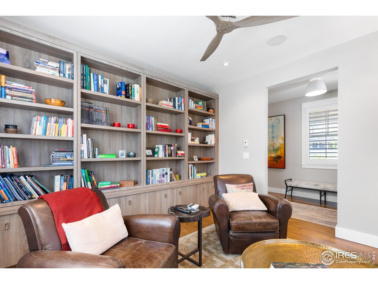 3191 9th Street Boulder, CO 80304 - Photo 17 of 40 a living room with furniture and a book shelf