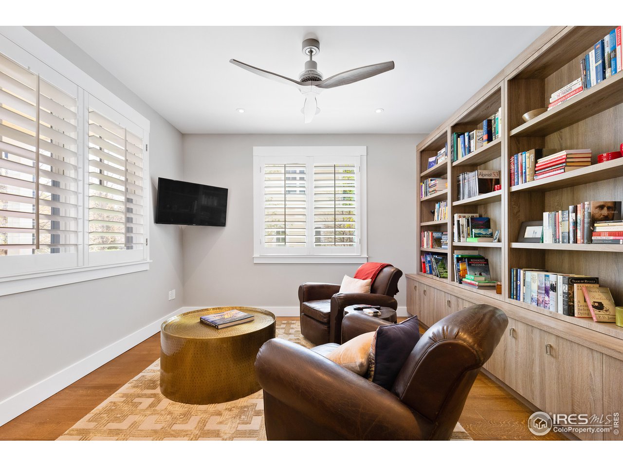 3191 9th Street Boulder, CO 80304 - Photo 18 of 40 a living room with furniture and a flat screen tv