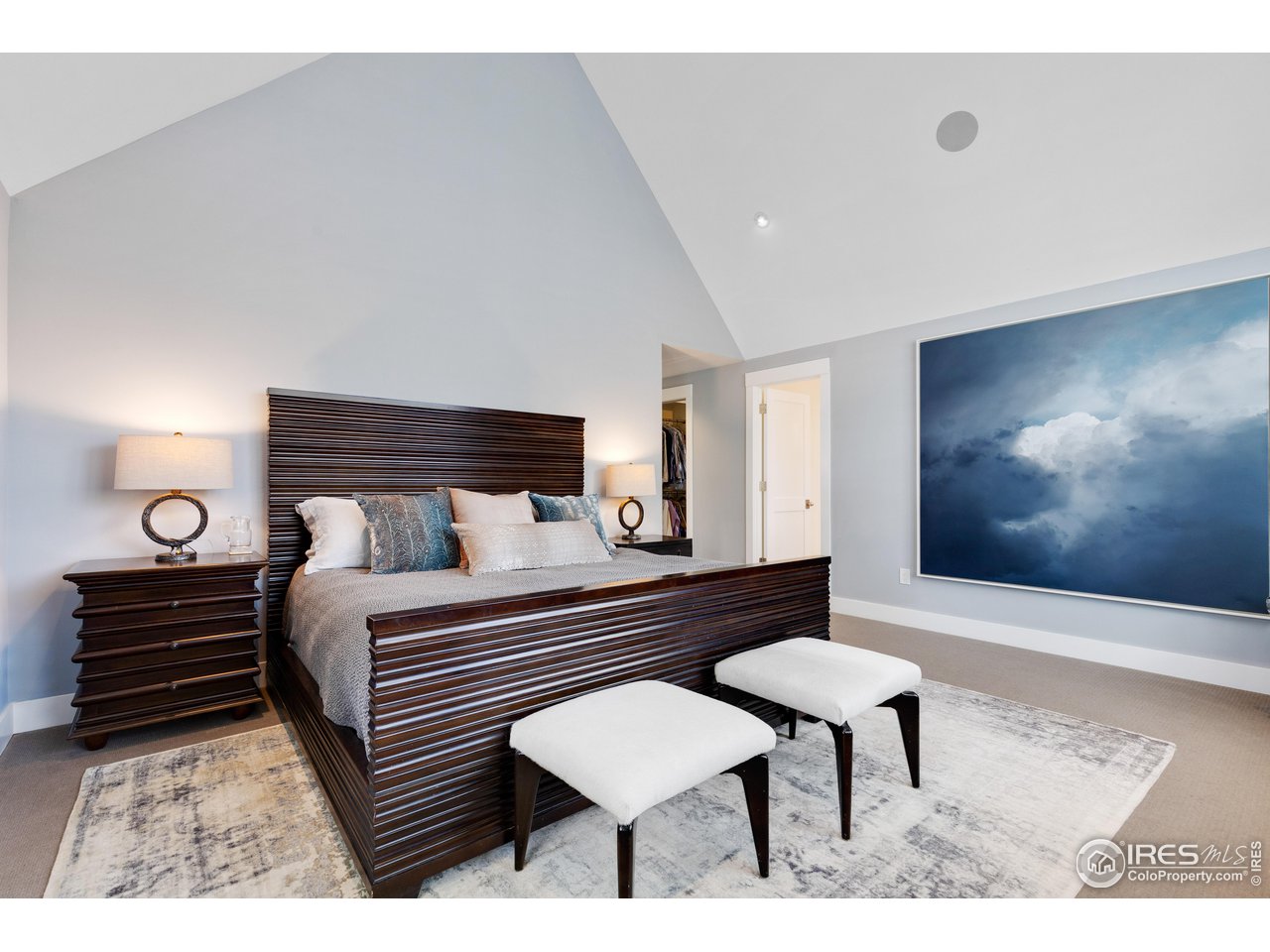 3191 9th Street Boulder, CO 80304 - Photo 19 of 40 a bedroom with a bed and a lamp with the dresser