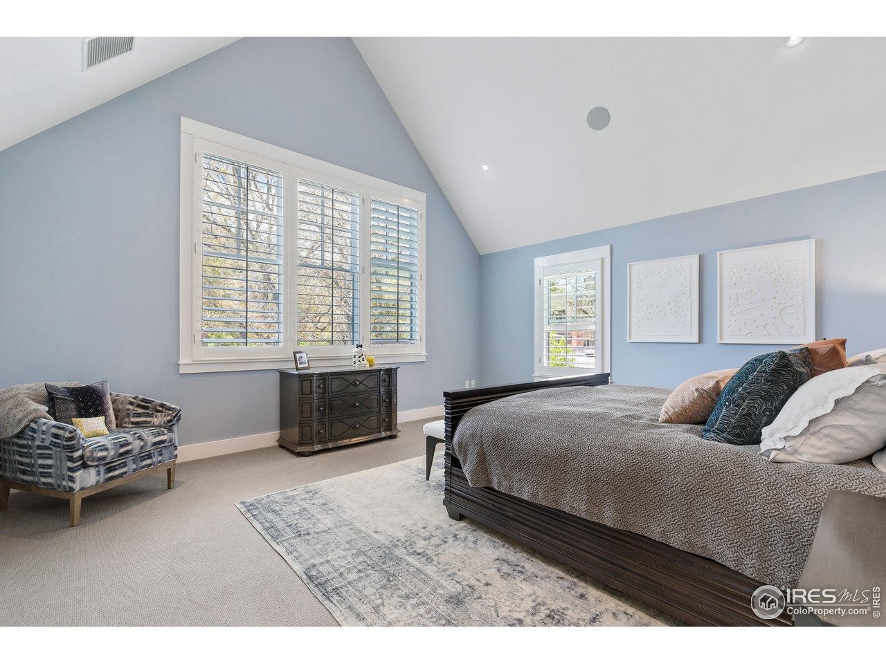 3191 9th Street Boulder, CO 80304 - Photo 21 of 40 a bedroom with a bed and a couch