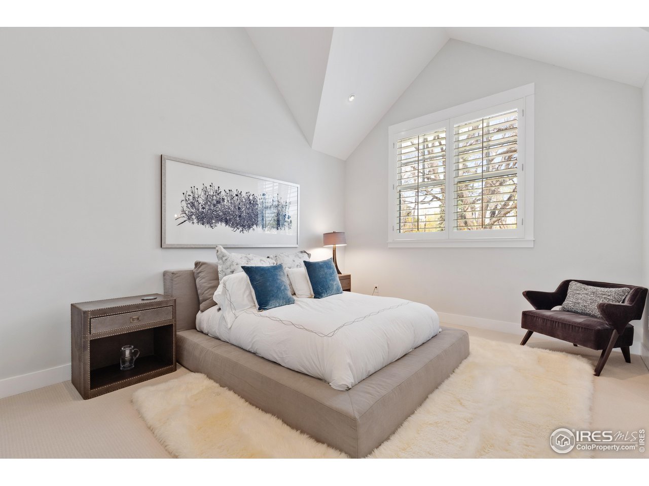 3191 9th Street Boulder, CO 80304 - Photo 24 of 40 a bedroom with a bed and a couch