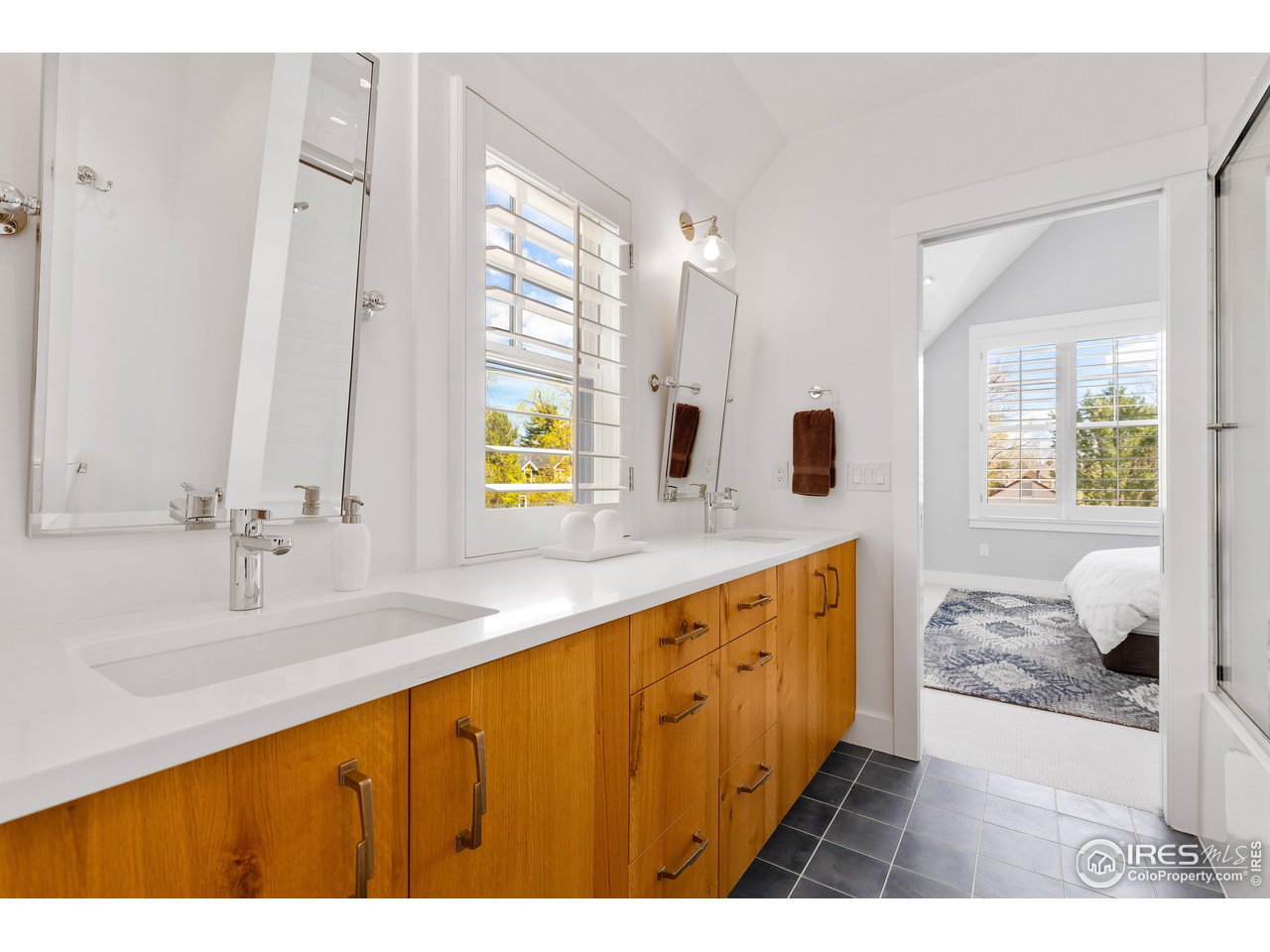 3191 9th Street Boulder, CO 80304 - Photo 25 of 40 a bathroom with a sink double vanity and a mirror