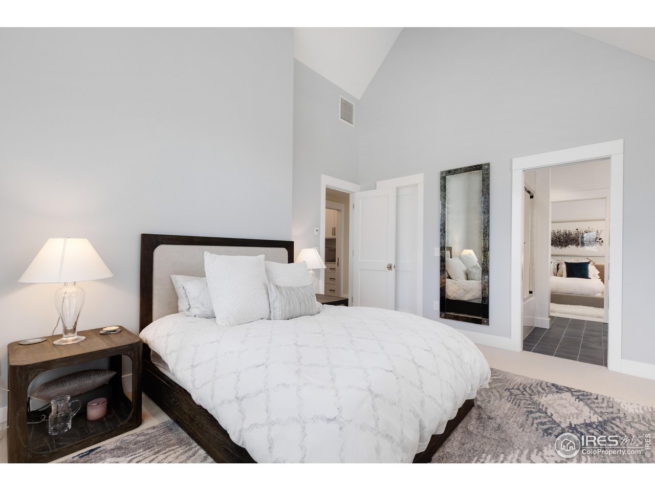 3191 9th Street Boulder, CO 80304 - Photo 26 of 40 a bedroom with a bed and a night stand