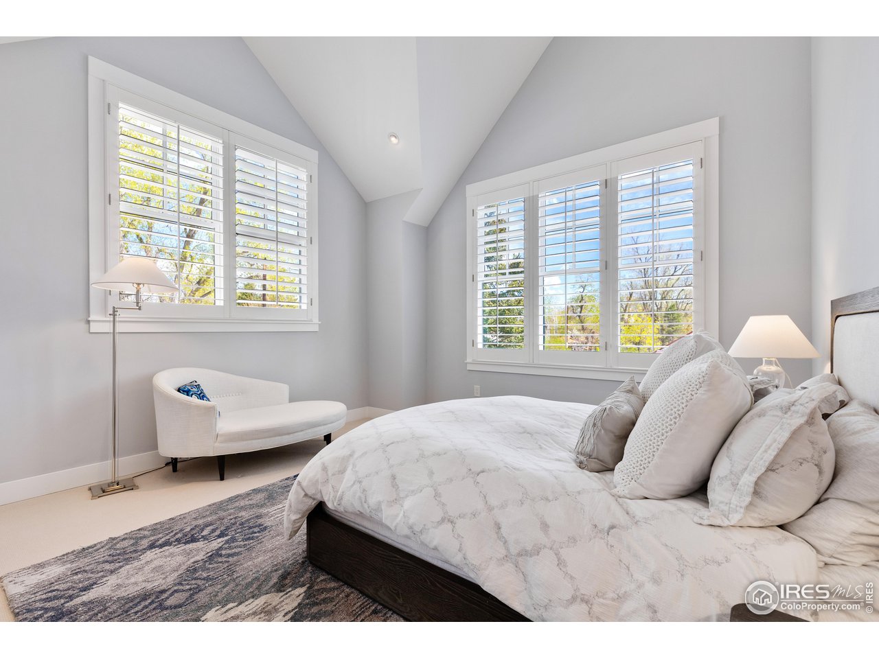 3191 9th Street Boulder, CO 80304 - Photo 27 of 40 a bedroom with a bed and a window