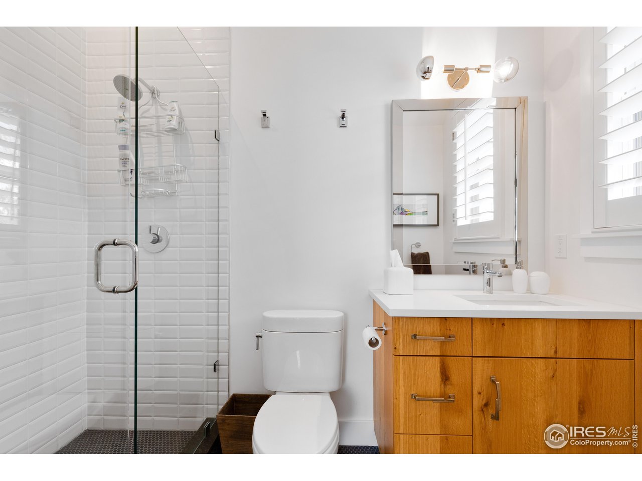 3191 9th Street Boulder, CO 80304 - Photo 29 of 40 a bathroom with a sink a toilet and shower