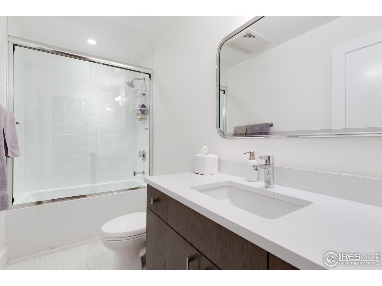 3191 9th Street Boulder, CO 80304 - Photo 36 of 40 a bathroom with a sink a toilet and shower