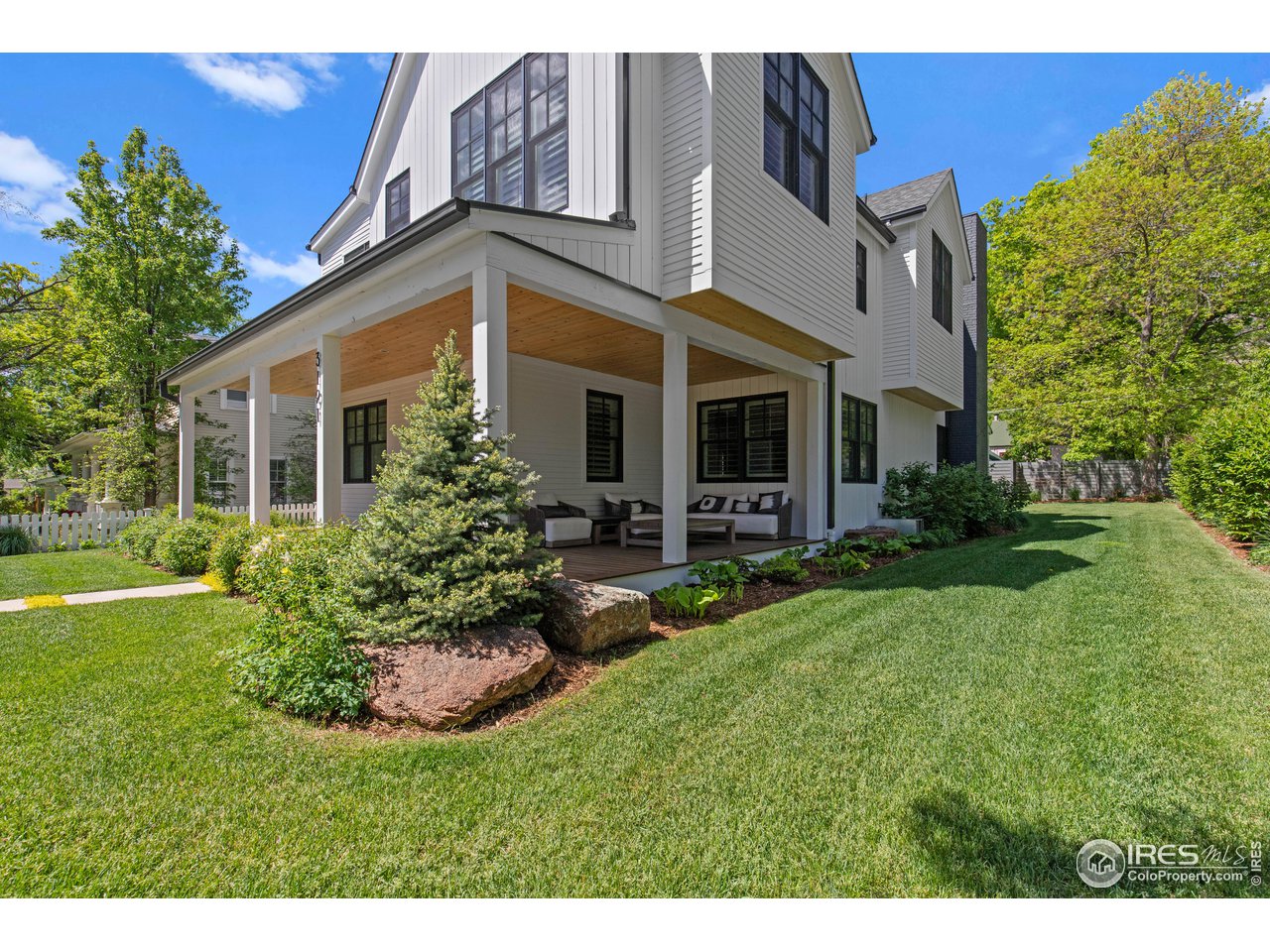 3191 9th Street Boulder, CO 80304 - Photo 38 of 40 a front view of house with yard and green space