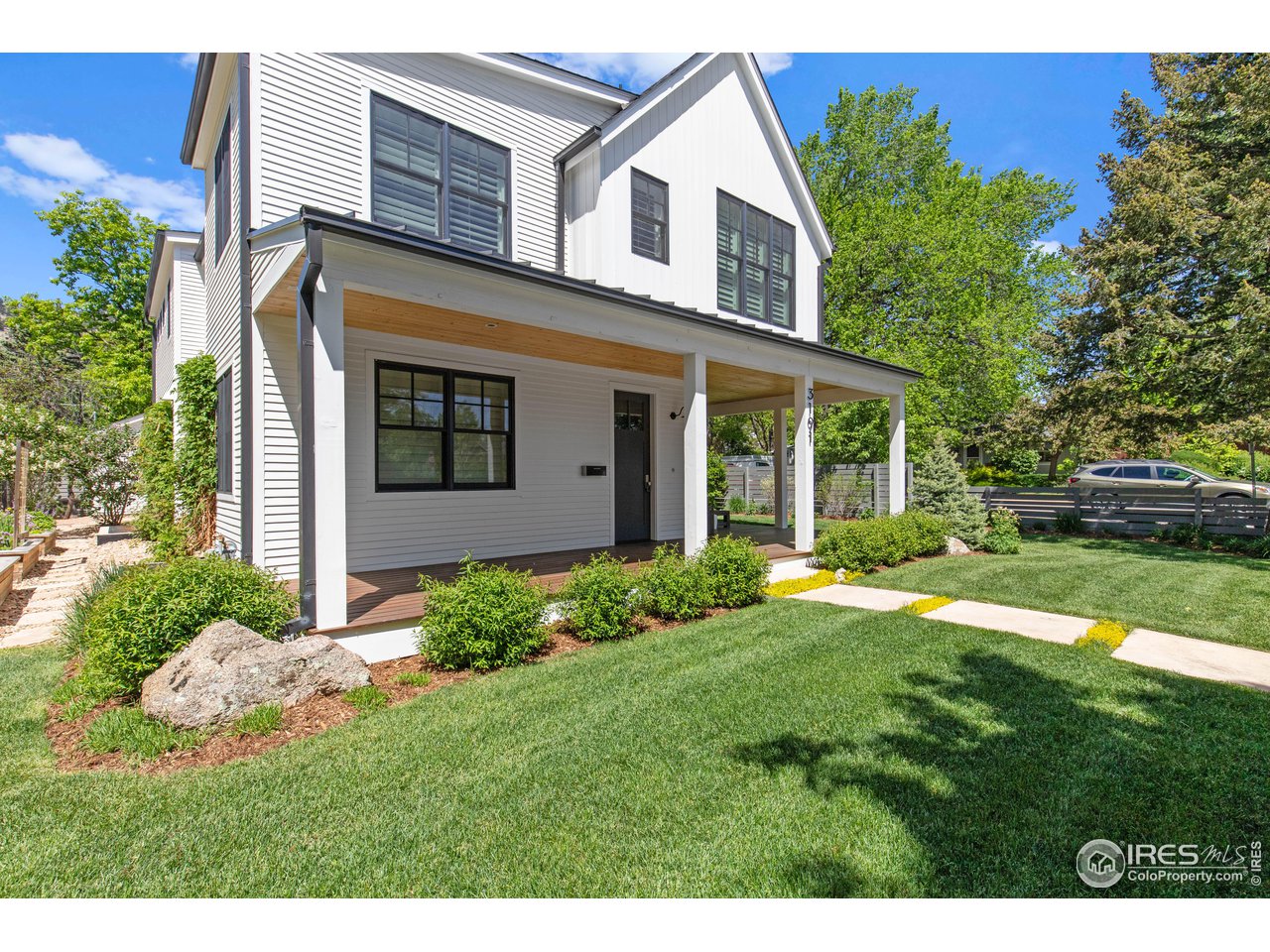 3191 9th Street Boulder, CO 80304 - Photo 39 of 40 a view of a house with yard and a garden