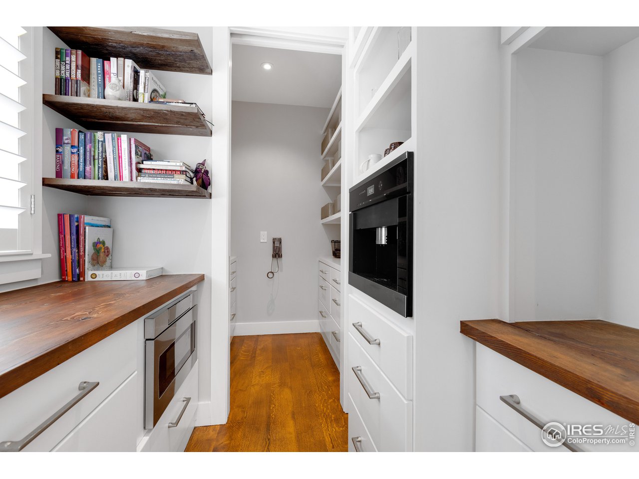 3191 9th Street Boulder, CO 80304 - Photo 4 of 40 a kitchen with stainless steel appliances granite countertop a stove a sink and a microwave