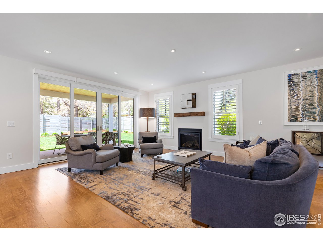 3191 9th Street Boulder, CO 80304 - Photo 10 of 40 a living room with furniture a fireplace and a large window