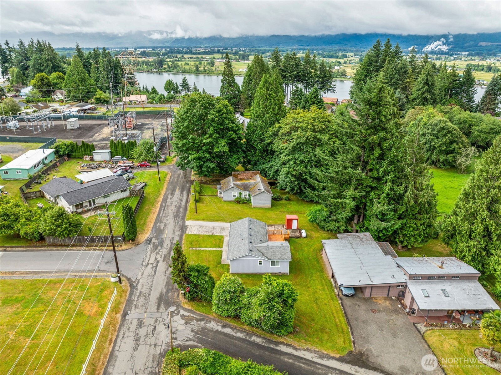 175 Jacobson Road Cathlamet, WA 98612 - Photo 7 of 32 an aerial view of a house with swimming pool and patio