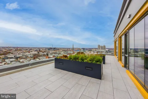 a view of a terrace with furniture and garden view