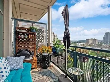 a view of balcony with furniture